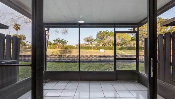 a view of an empty room with a large window
