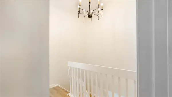 a white wall with a window