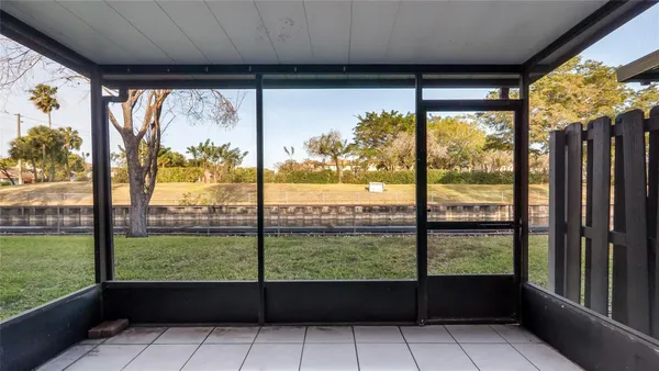 a view of large windows and a big yard