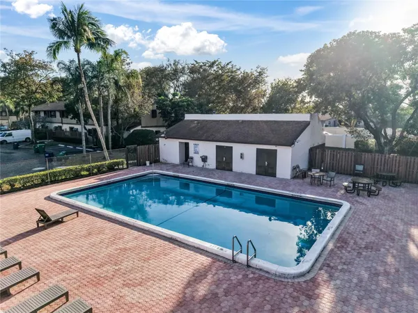 a view of a swimming pool with a patio
