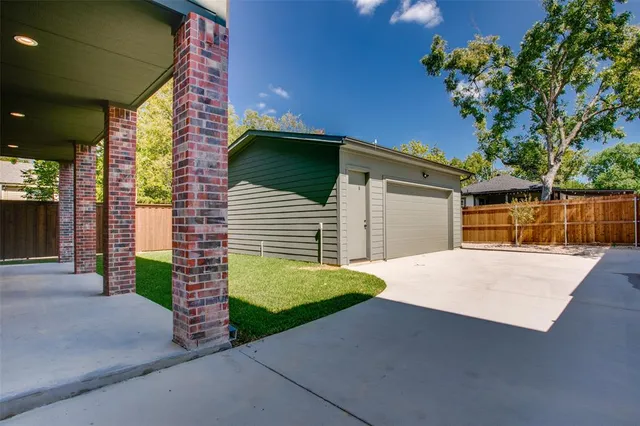 a yellow house with trees in front of it