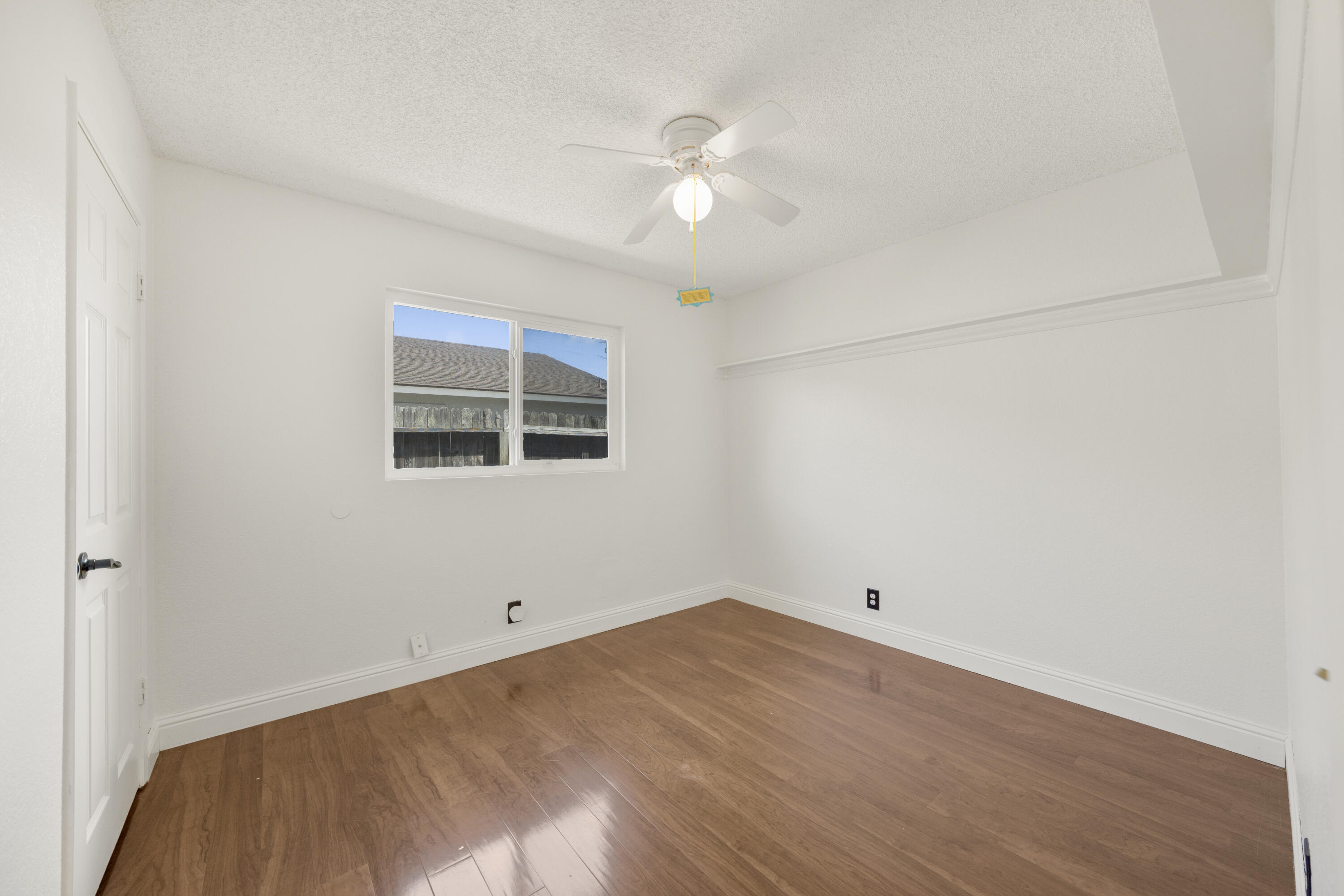 908 Northpoint Place Lompoc, CA 93436 - Photo 12 of 21 a view of a big room with wooden floor and windows