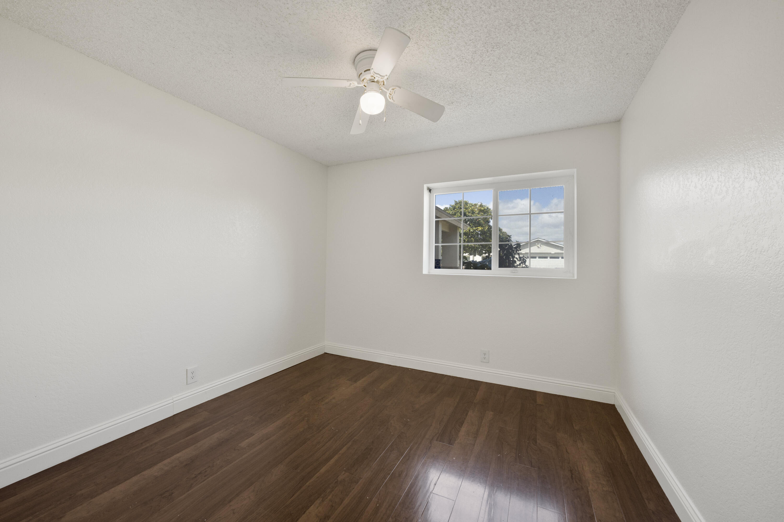 908 Northpoint Place Lompoc, CA 93436 - Photo 14 of 21 an empty room with wooden floor and windows
