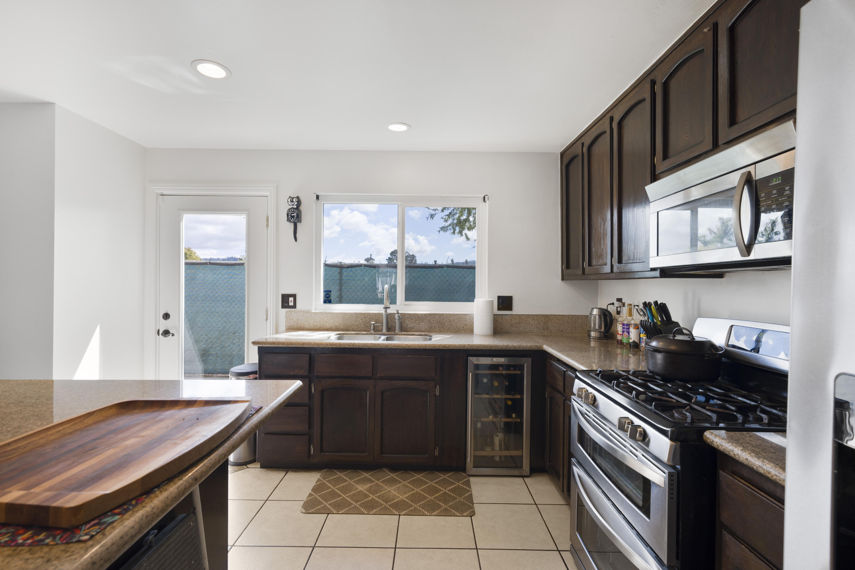 908 Northpoint Place Lompoc, CA 93436 - Photo 7 of 21 a kitchen with a stove sink and cabinets