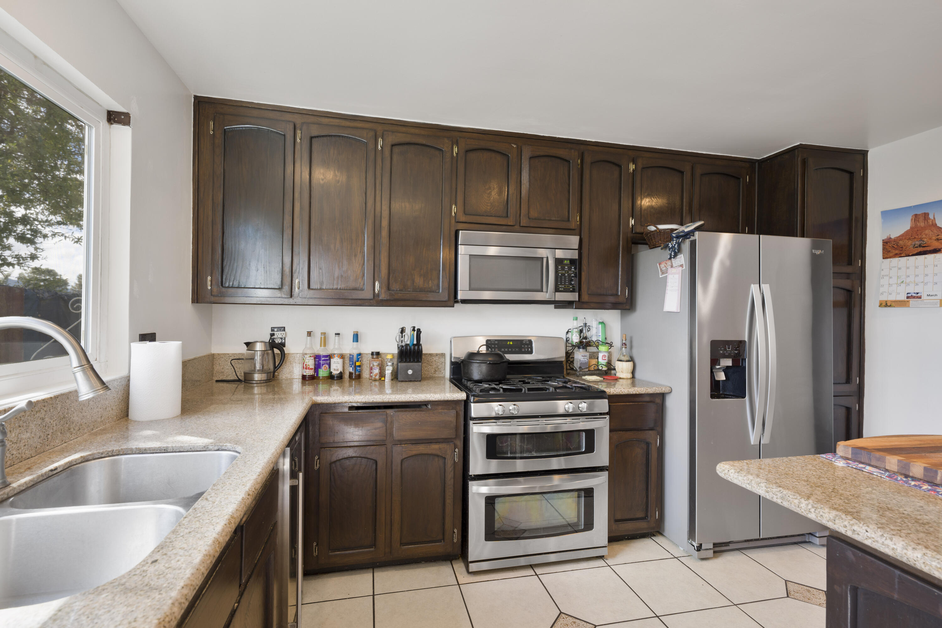 908 Northpoint Place Lompoc, CA 93436 - Photo 8 of 21 a kitchen with stainless steel appliances granite countertop a refrigerator stove and sink