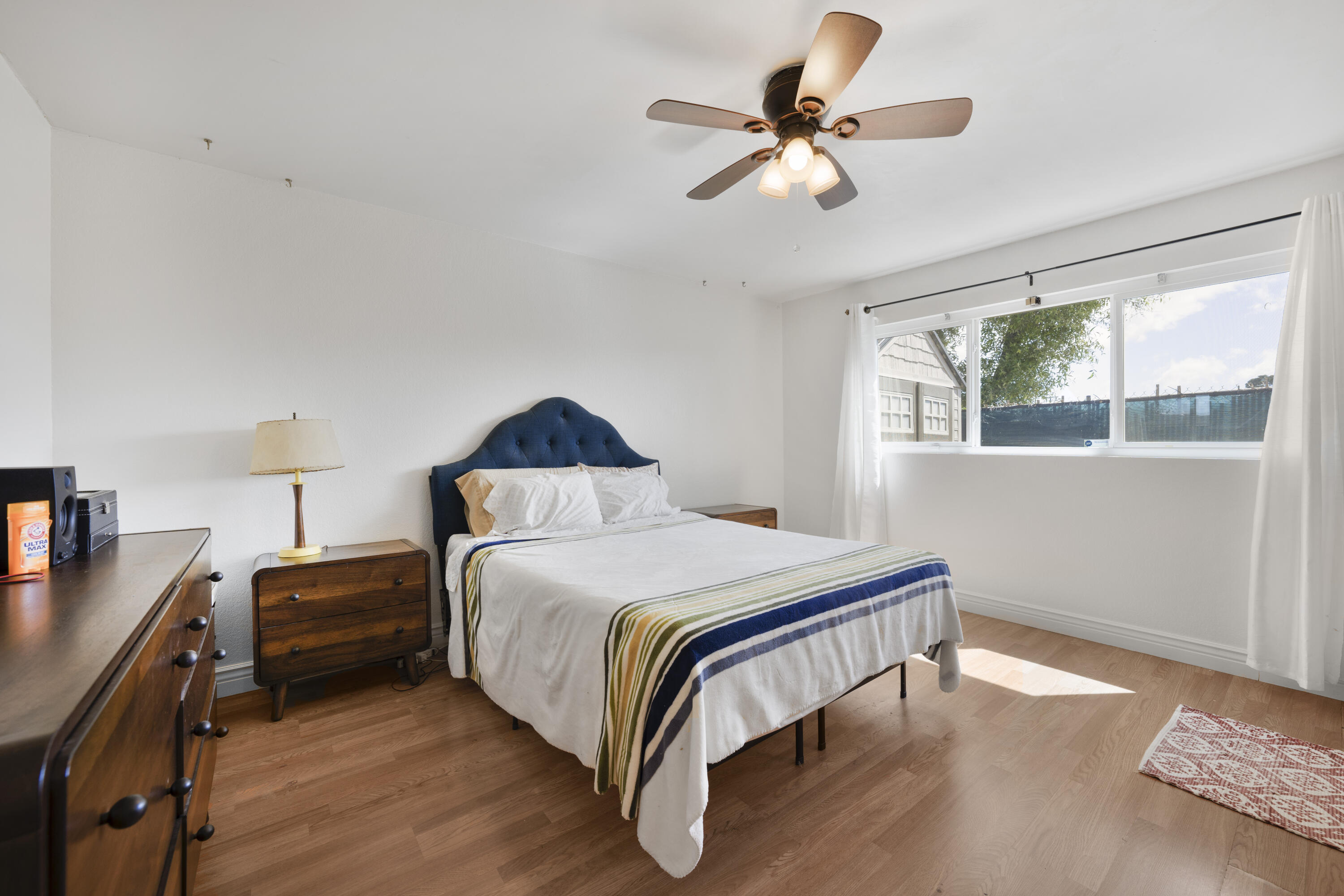 908 Northpoint Place Lompoc, CA 93436 - Photo 9 of 21 a bedroom with a bed and a chandelier