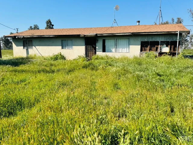 a front view of a house with yard