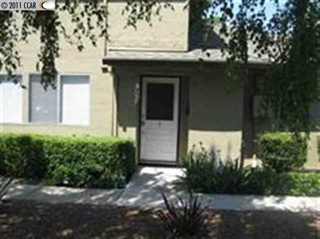 1341 Del Rio Court, Unit 3 Concord, CA 94518 - Photo 1 of 1 a front view of a house with garden