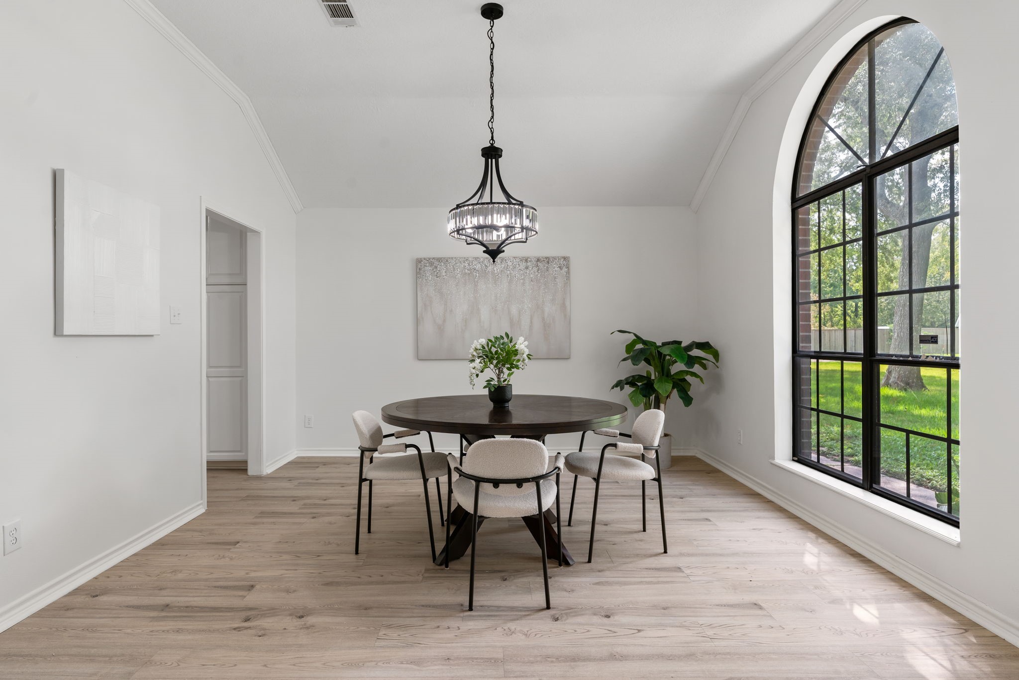 10 Autumn Oaks Drive Baytown, TX 77521 - Photo 11 of 38 a dining room with furniture a potted plant and a chandelier