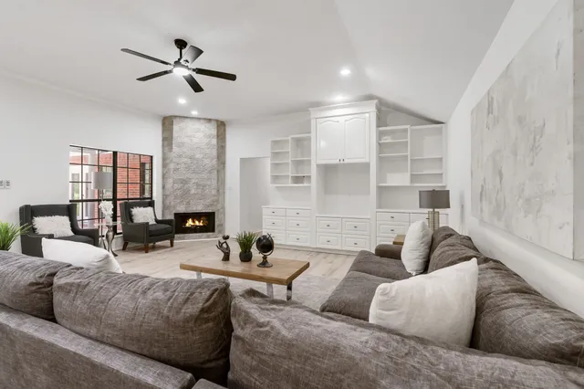 a living room with furniture and a large window