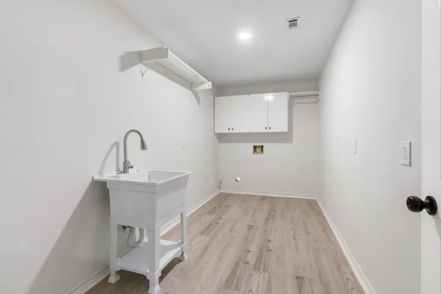 a room with a sink and a mirror