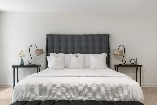 a bedroom with a bed and window