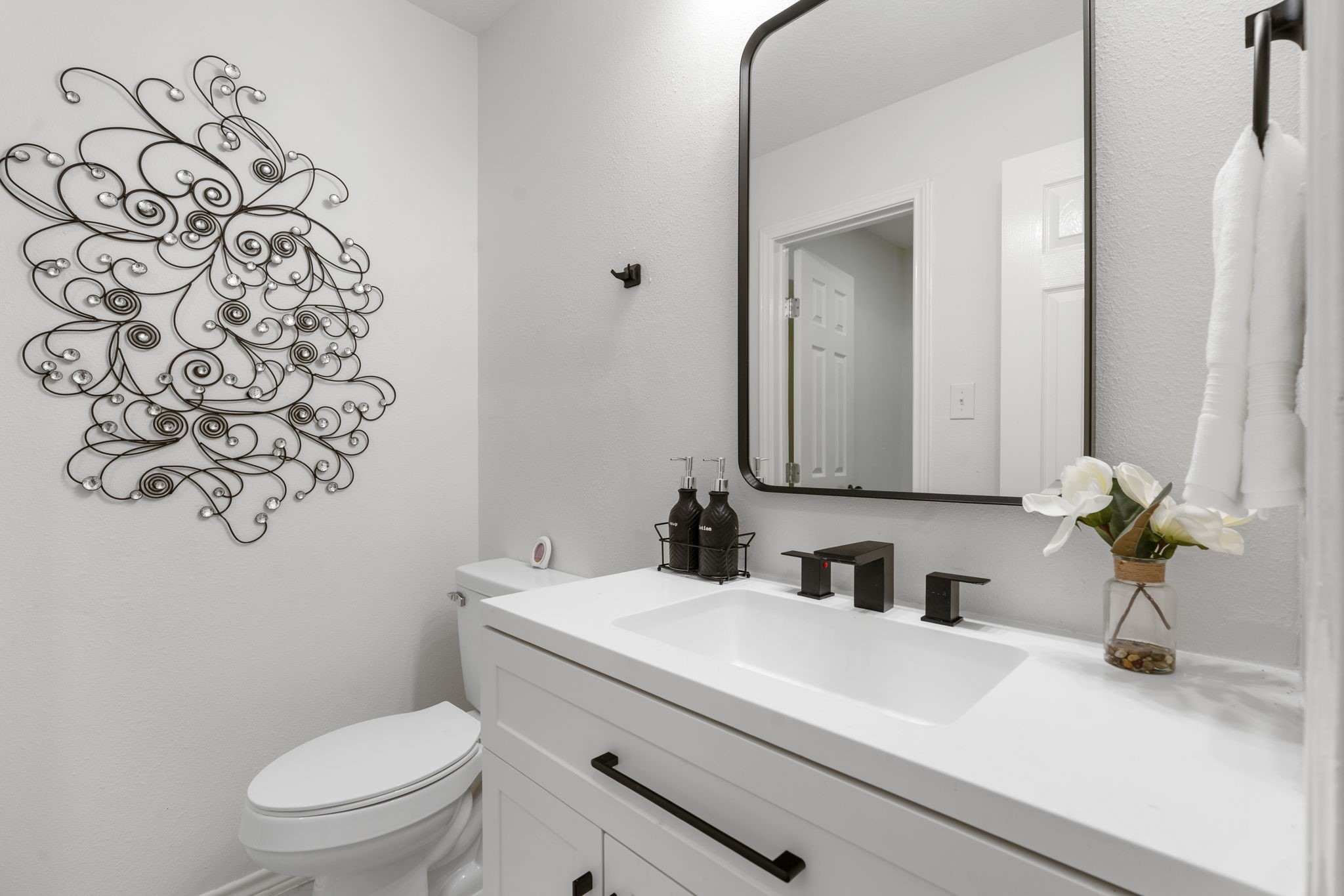 10 Autumn Oaks Drive Baytown, TX 77521 - Photo 35 of 38 a bathroom with a granite countertop toilet sink and mirror