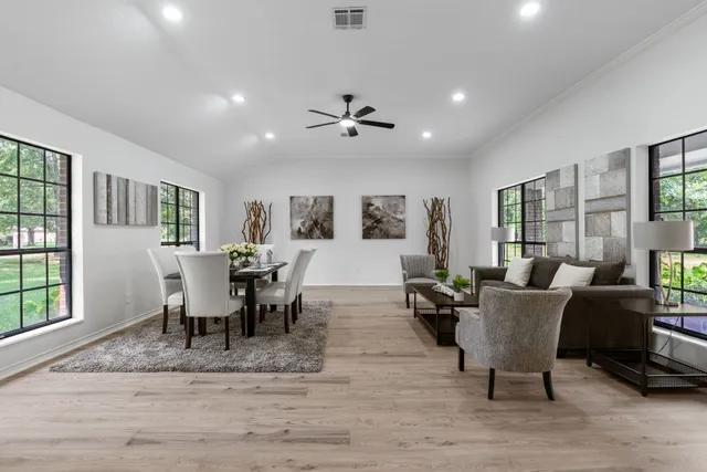a living room with furniture dining table and a window