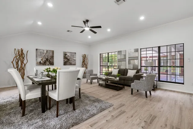 a living room with furniture and a large window