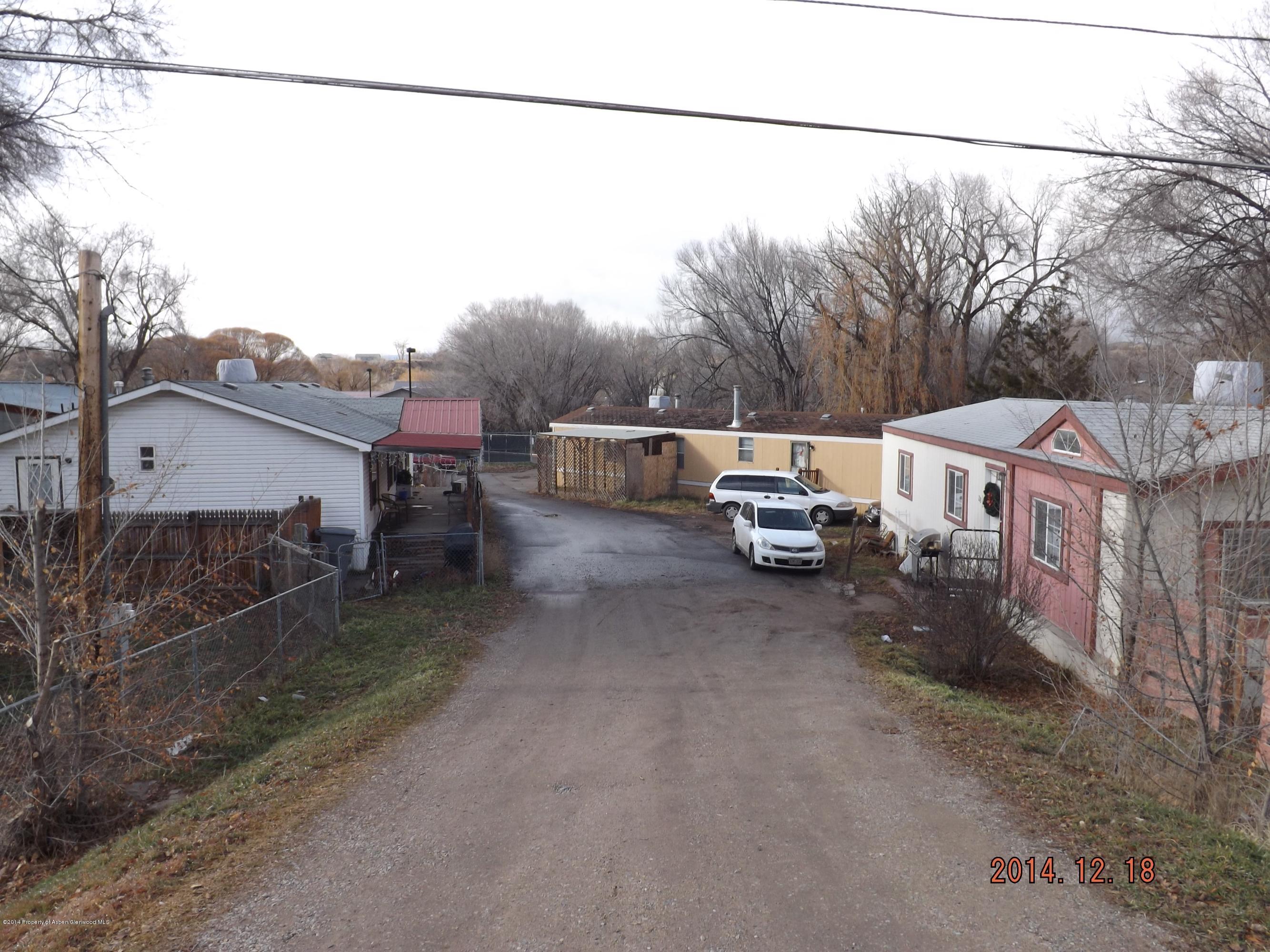 226 East 9th Street Rifle, CO 81650 - Photo 1 of 20 a couple of cars parked in front of a house