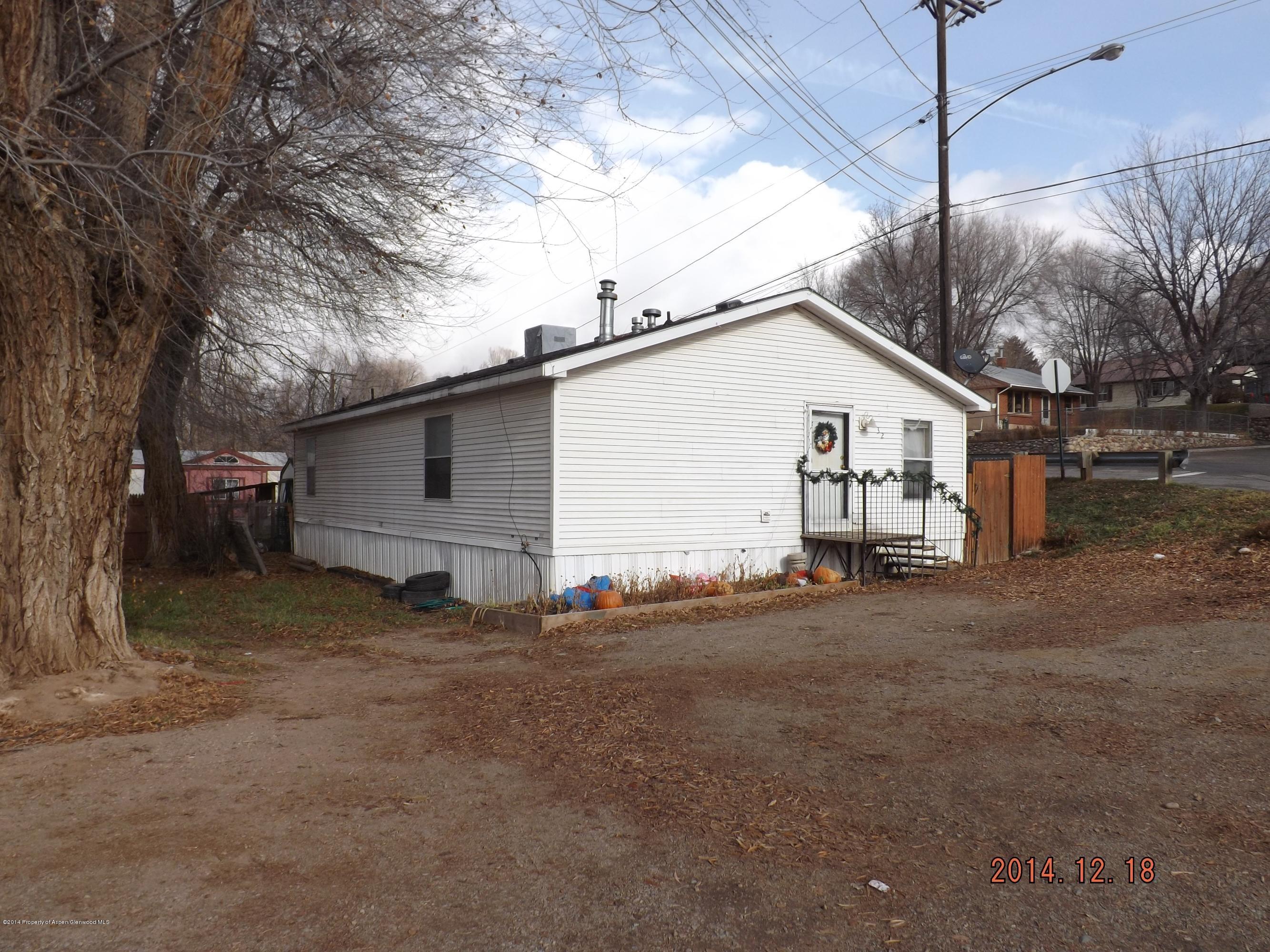 226 East 9th Street Rifle, CO 81650 - Photo 3 of 20 a view of a house with a backyard