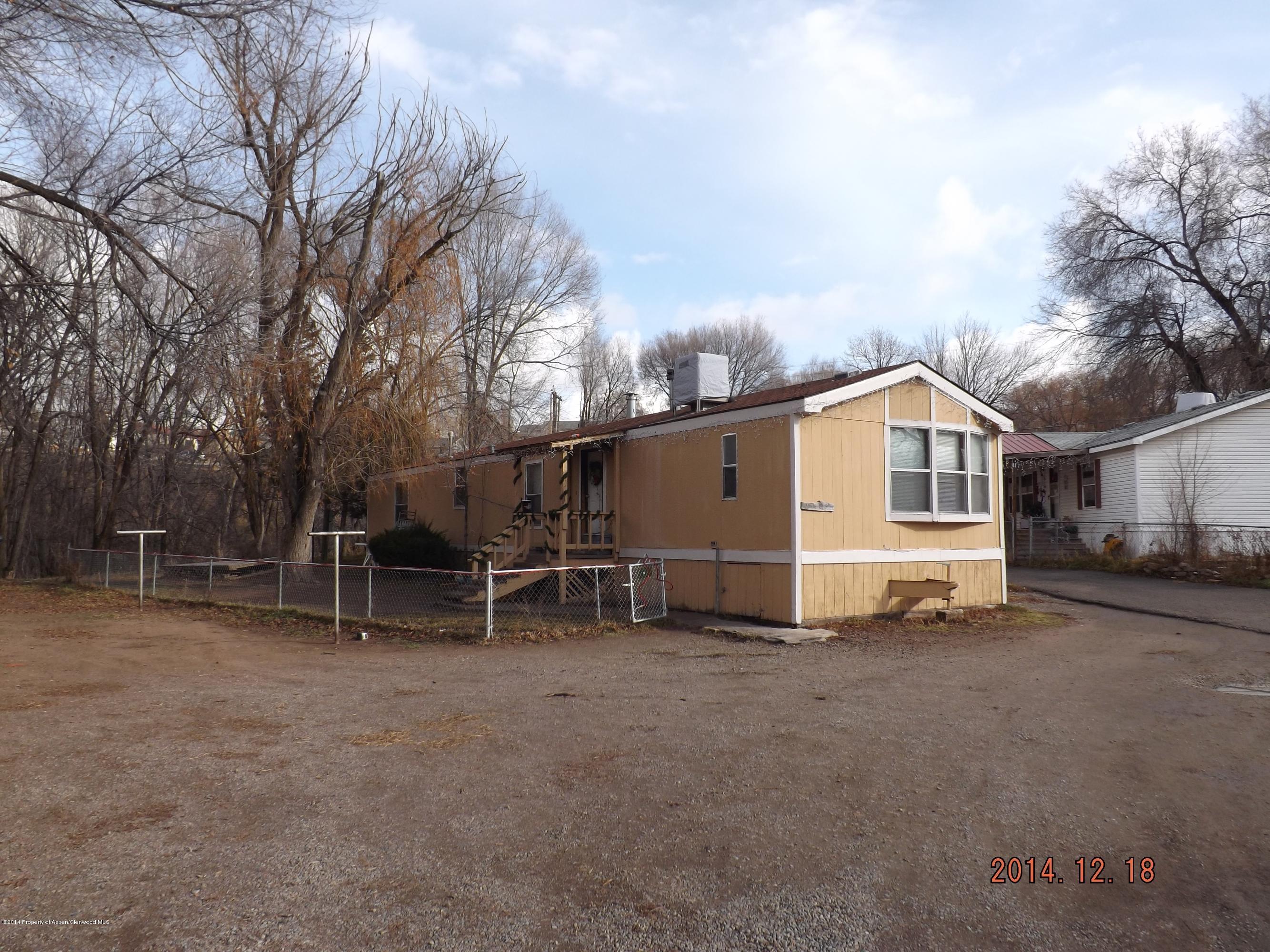 226 East 9th Street Rifle, CO 81650 - Photo 7 of 20 a view of a house with a yard