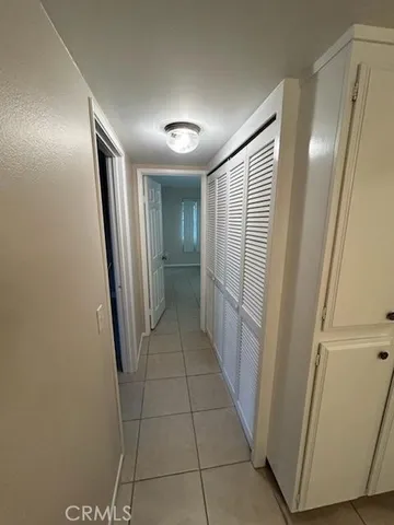 a view of hallway with cabinets