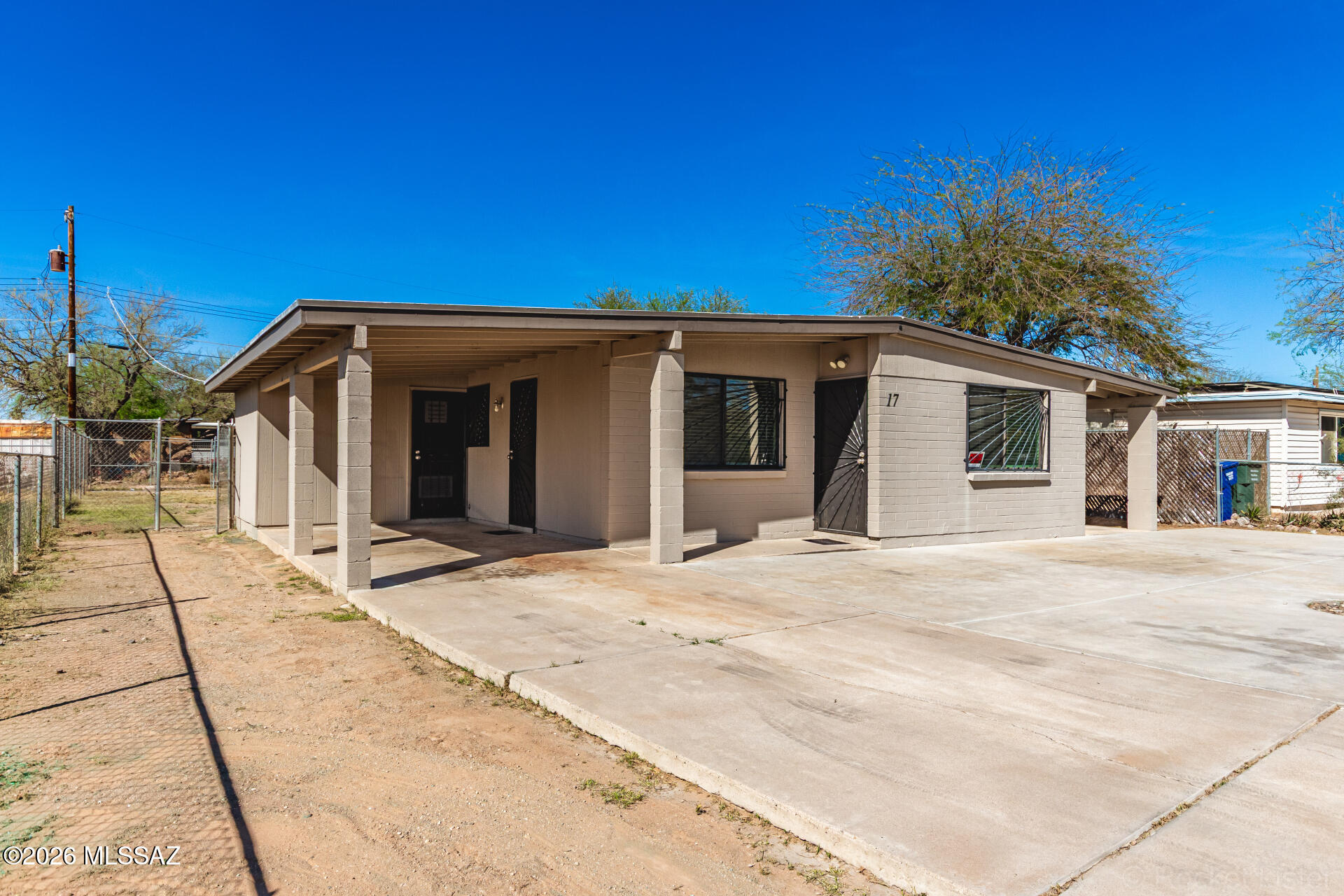 17 East Los Reales Road Tucson, AZ 85756 - Photo 3 of 27 a view of a white house with a outdoor space