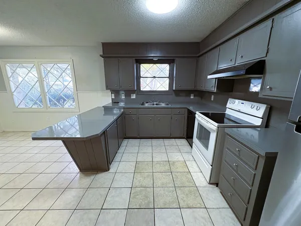 a view of an empty room and staircase