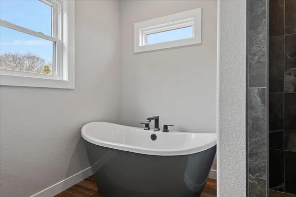 a bathroom with a sink and a window