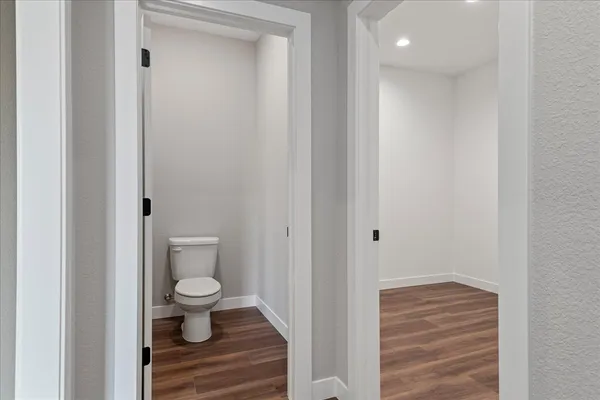 a bathroom with a toilet and a sink