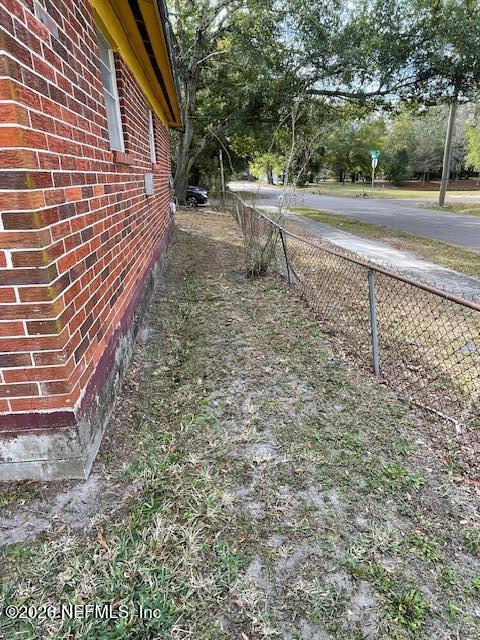 3563 Dillon Street Jacksonville, FL 32254 - Photo 12 of 15 a backyard of a house with lots of green space