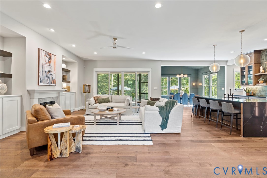 4764 Gooden Trail Quinton, VA 23141 - Photo 21 of 50 Living room with light wood-style flooring, a fire
