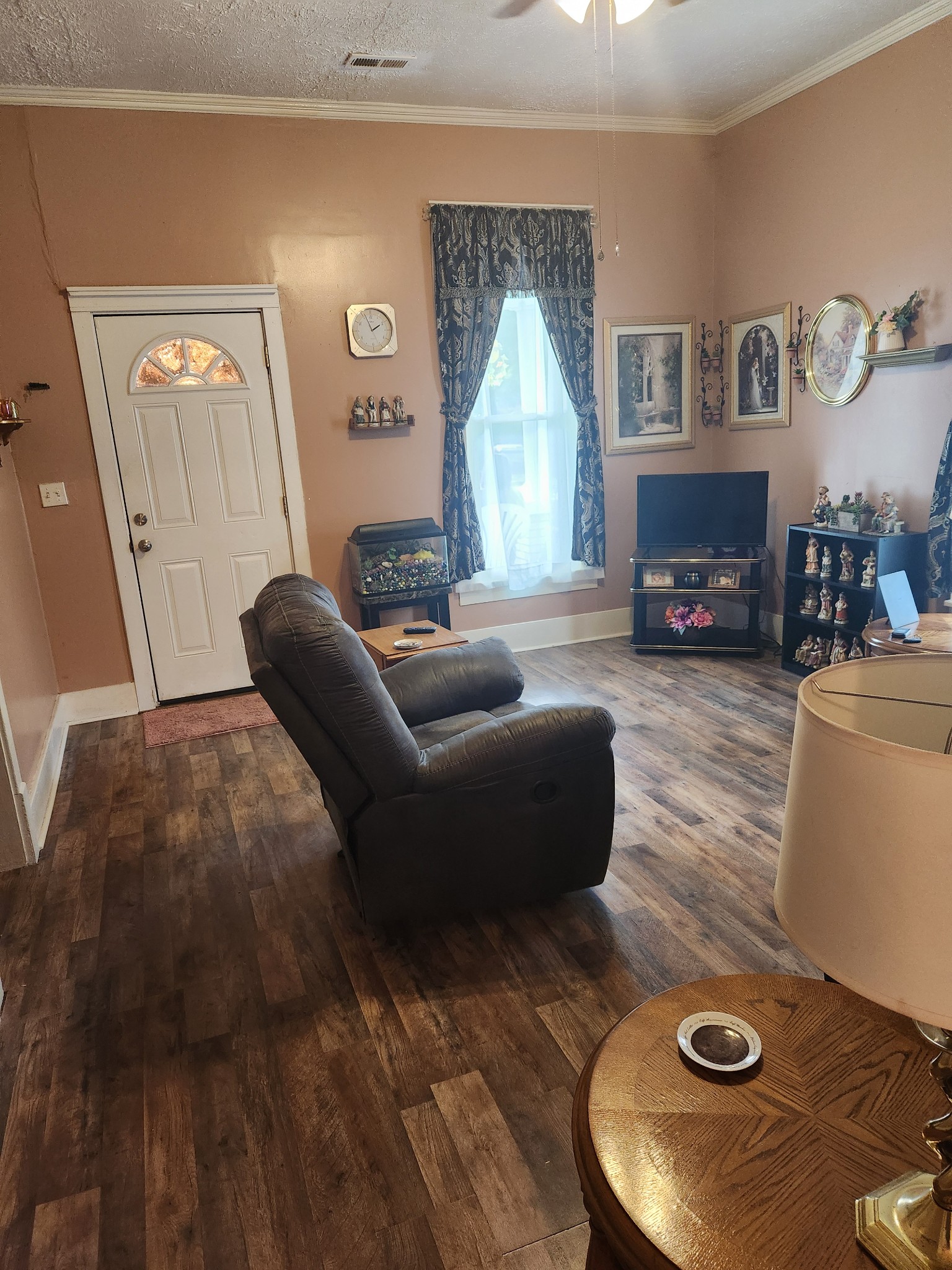 300 South Russell Street Portland, TN 37148 - Photo 11 of 14 a living room with furniture and a fireplace