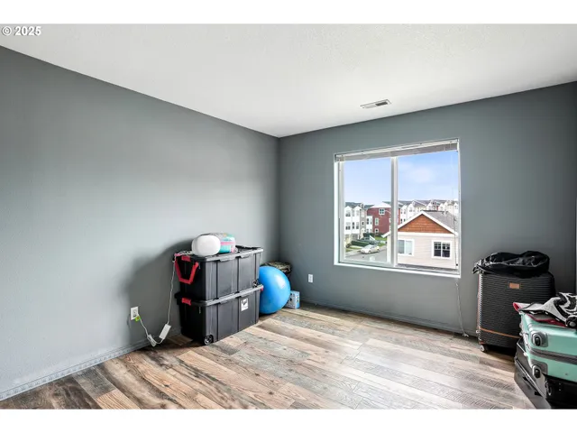 a room with a bed and window