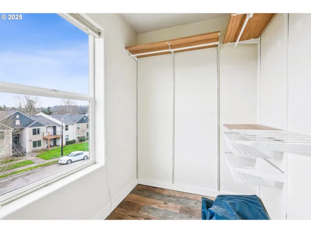 a view of an entryway with wooden floor