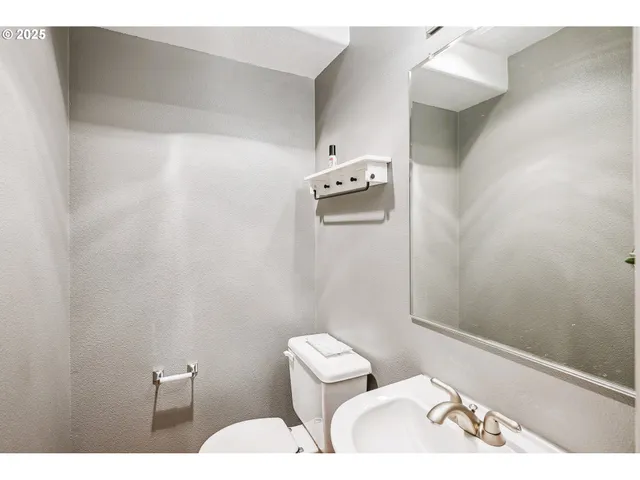 a bathroom with a toilet and a sink