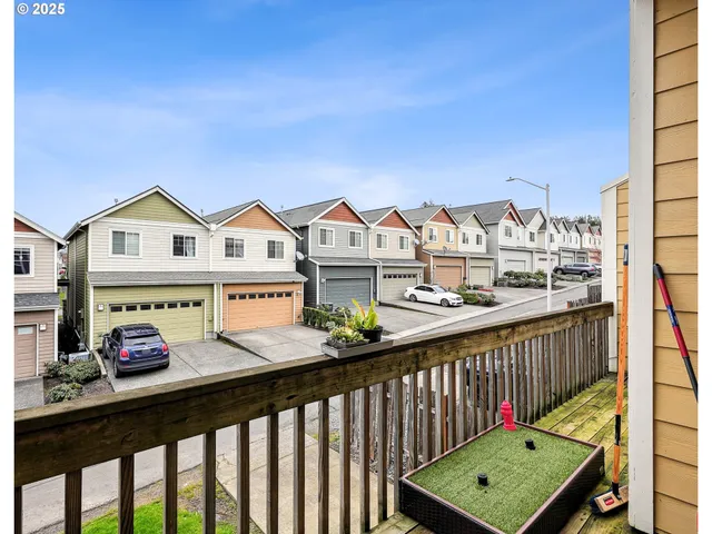 a view of a street with tall buildings and a street view