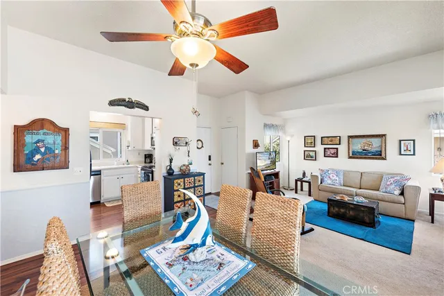 a living room with furniture a rug and a chandelier
