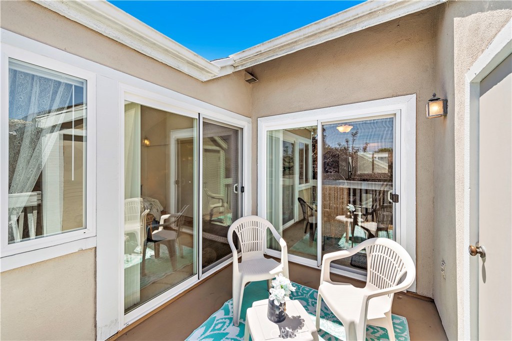 34110 Selva Road, Unit 321 Dana Point, CA 92629 - Photo 19 of 29 a balcony with table and chairs