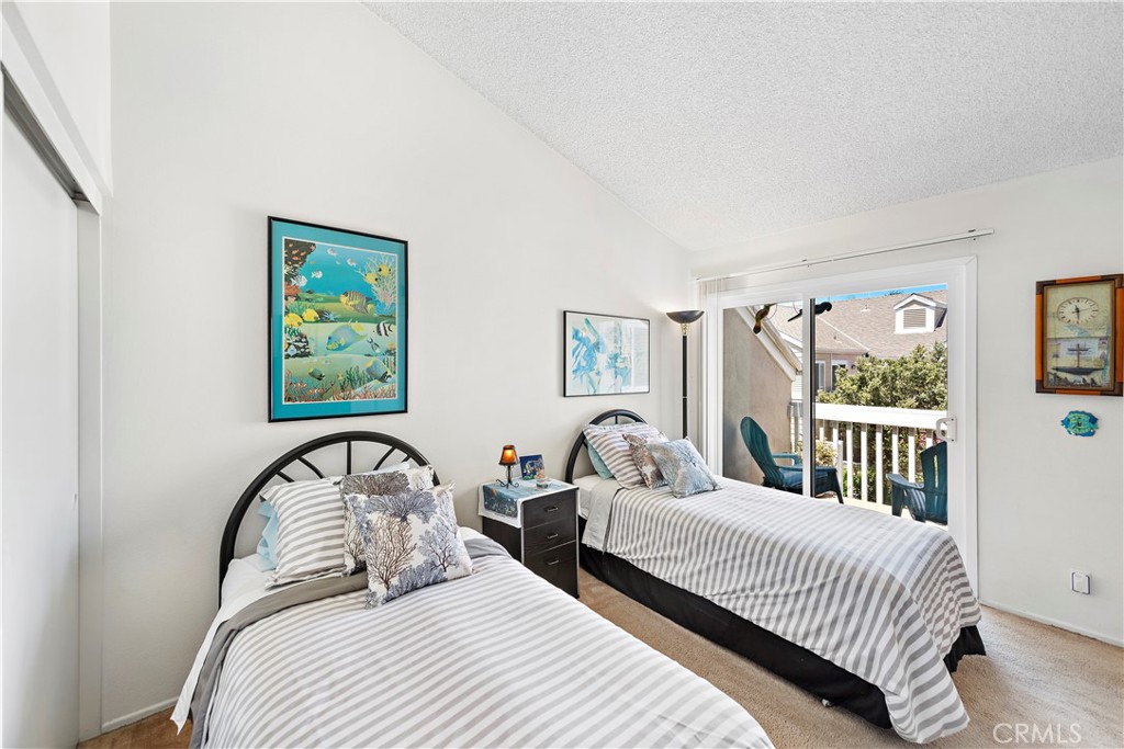 34110 Selva Road, Unit 321 Dana Point, CA 92629 - Photo 24 of 29 a bedroom with bed and a window