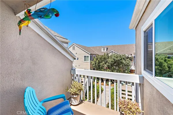 a view of a balcony with chairs