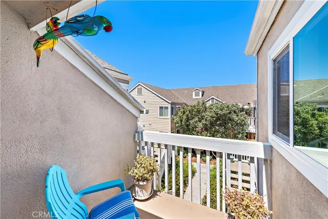 a view of a balcony with chairs