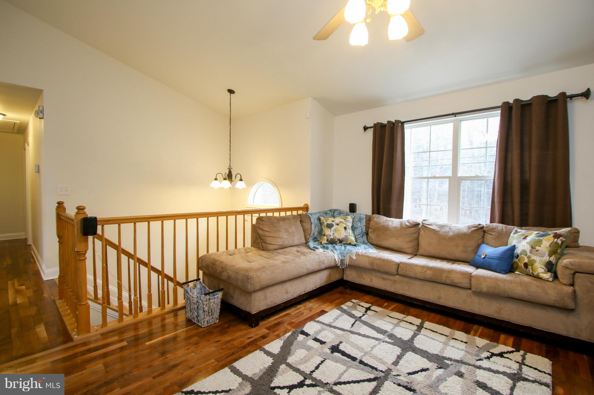 1432 Grimm Road Severn, MD 21144 - Photo 4 of 23 Spacious Open Living Room w/ Cathedral Ceilings