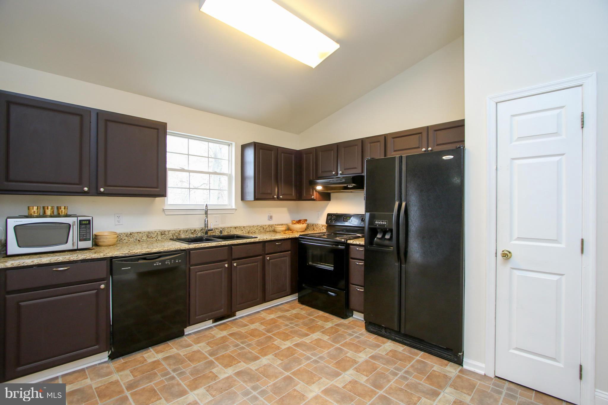 1432 Grimm Road Severn, MD 21144 - Photo 7 of 23 Renovated open kitchen with updated appliances