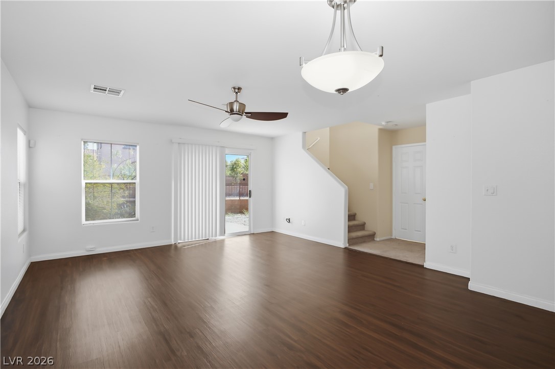 1172 Gecko Road Henderson, NV 89002 - Photo 8 of 30 A versatile open-concept living space features rich vinyl laminate flooring and abundant natural light.