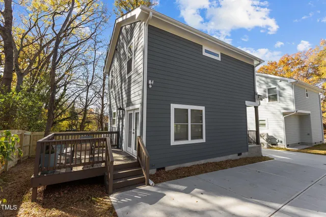 a view of balcony with wooden floor and fence