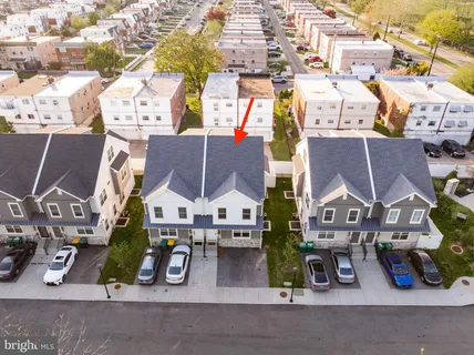 an aerial view of residential houses with street