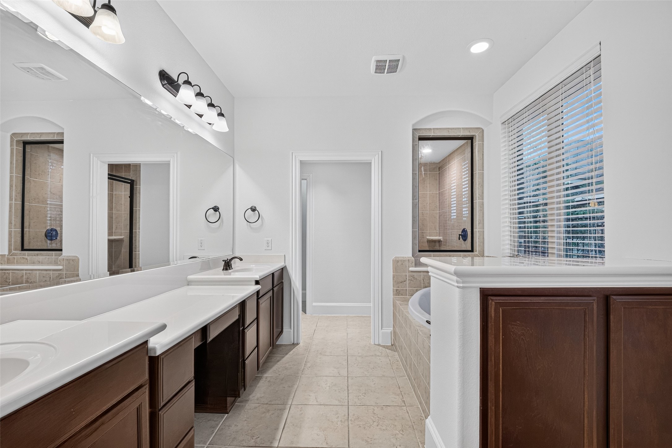7930 Summer Night Lane Rosenberg, TX 77469 - Photo 23 of 48 Primary bath offering dual vanities, generous storage, and a bright, functional layout.