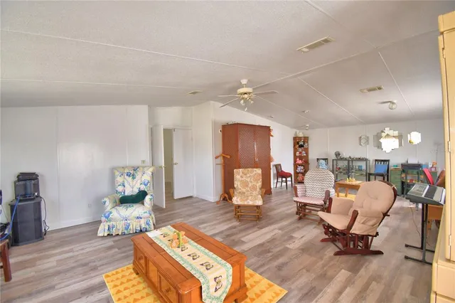 a kitchen with a sink a window stainless steel appliances and cabinets