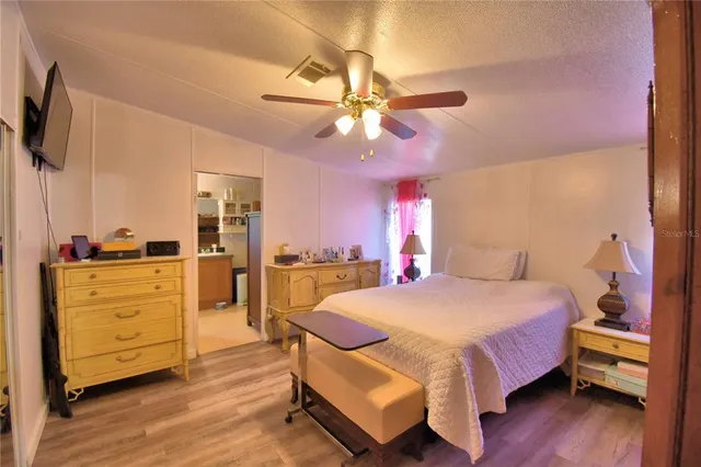 a work room with furniture and wooden floor