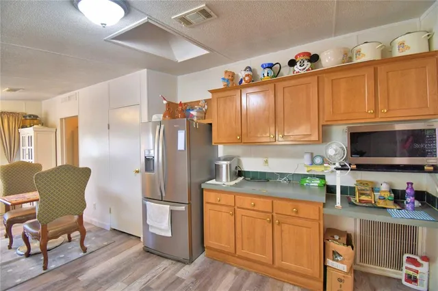 a view of a porch with a table and chairs