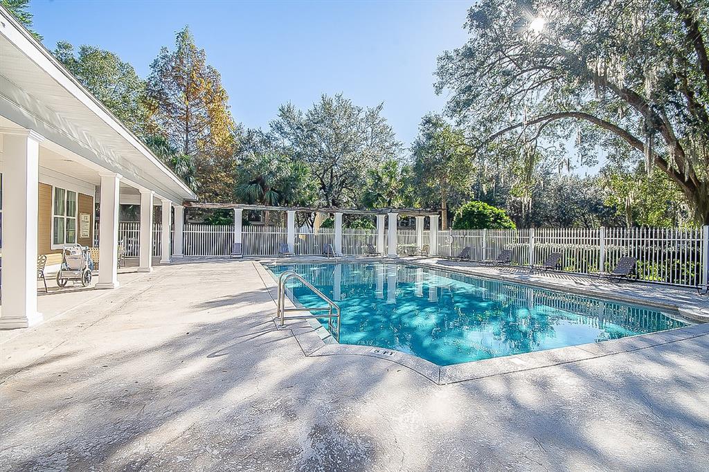 4850 Southwest 91 Terrace, Unit 301 Gainesville, FL 32608 - Photo 19 of 24 a view of backyard with green space