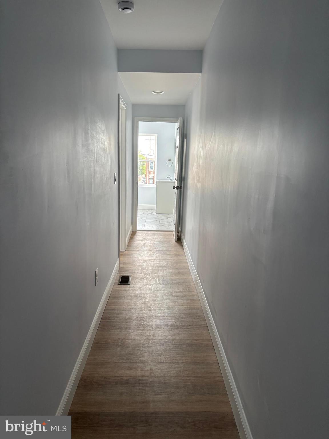 2505 Federal Street Baltimore, MD 21213 - Photo 12 of 26 a view of a hallway with wooden floor